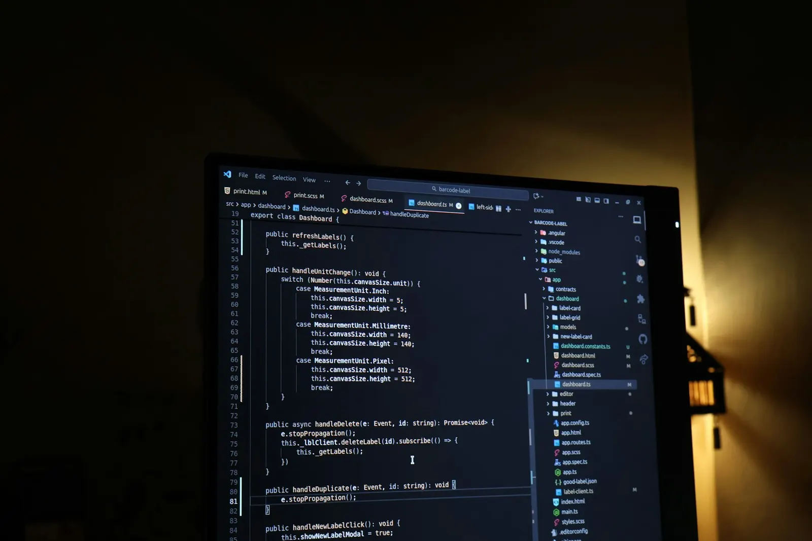 Source code open in an editor on a dark monitor