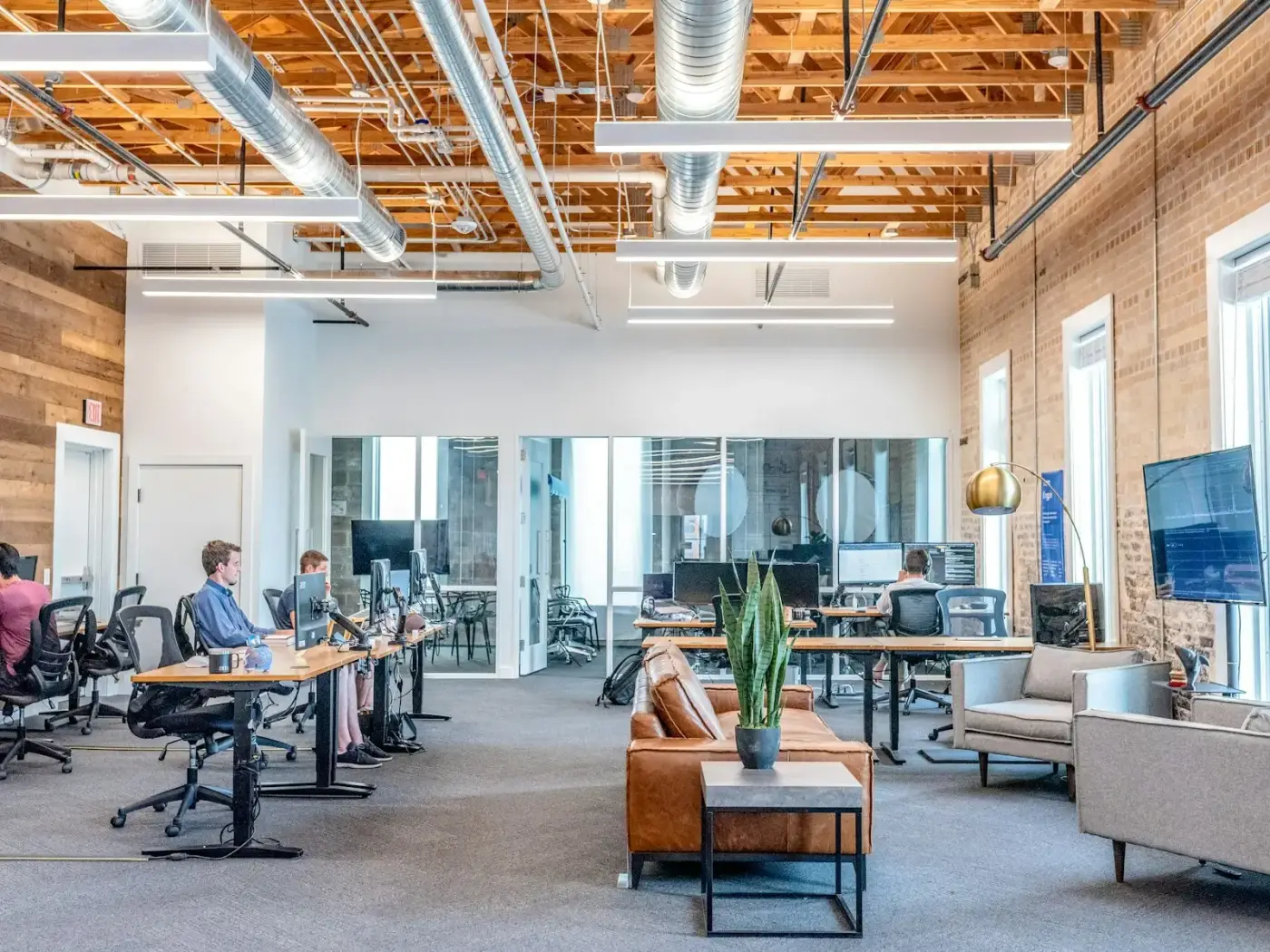 Bright open-plan office with desks and meeting areas